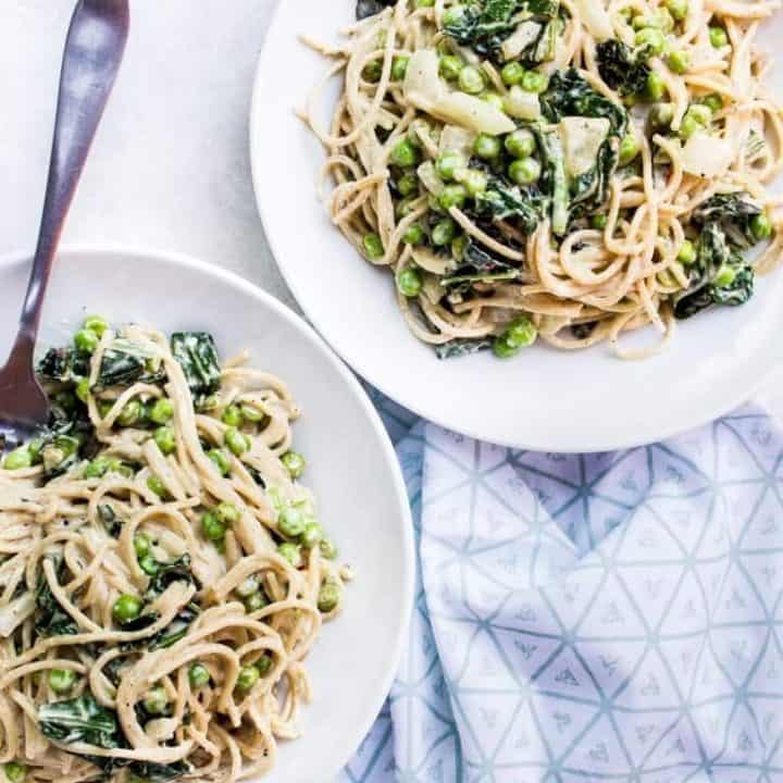 Spicy Tahini Pasta with Sautéed Kale + Peas + Onion