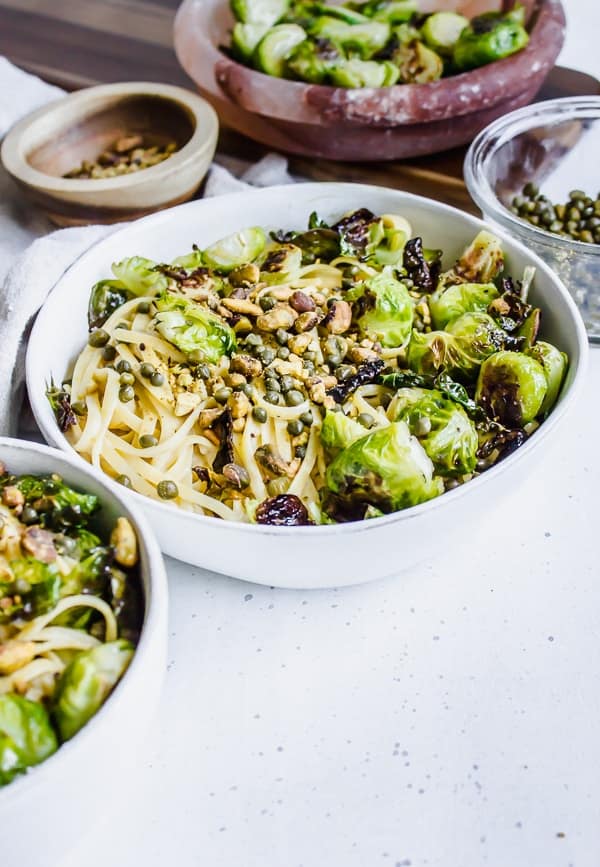 Cheesy Tahini Pasta with Brussels Sprouts, Capers, and Pistachios