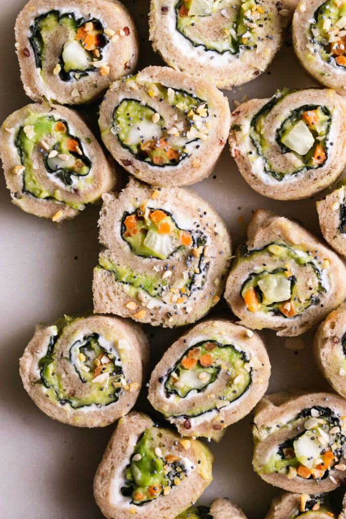 close up of sliced veggie sushi sandwich rollups revealing the filling