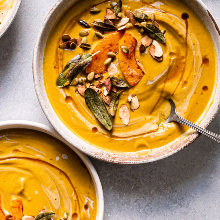 two bowls of roasted butternut squash carrot soup
