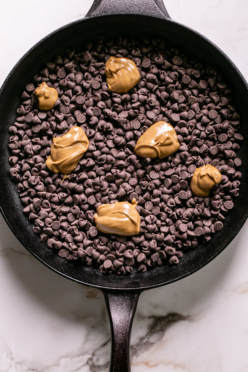 sunflower seed butter dolloped over the chocolate chips in the calphalon cast iron skillet