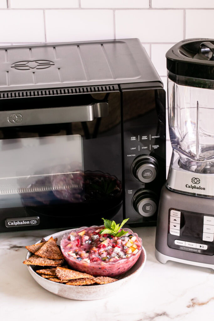 Air Fryer Churro Chips and Fruit Salsa in front of the Calphalon air fry oven and blender