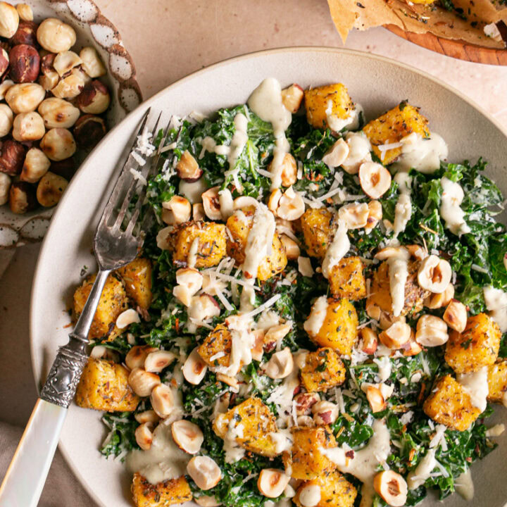 close up shot of Kale Caesar Salad with Polenta Croutons and Toasted Hazelnuts