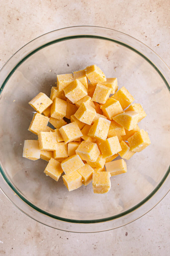 polenta cut into cubes in a glass bowl